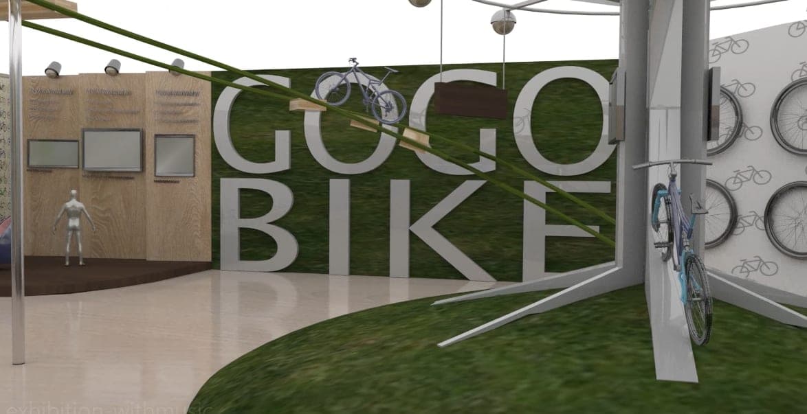 3D render of the GOGOBIKE booth: oversized logo letters on a grass-textured wall, a suspended bike, wooden info panels with screens, and a wheel display wall
