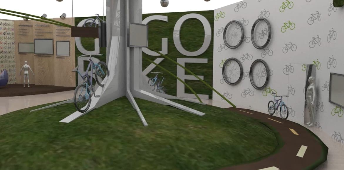 3D render inside the GOGOBIKE booth: bikes mounted on a central pylon over grass, wheel display wall, bike-patterned wallpaper, and road-marked floor path.