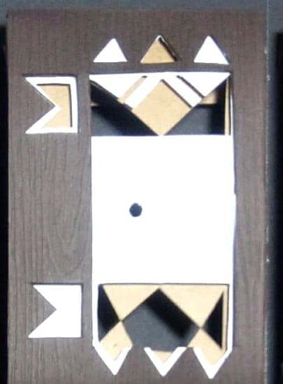 Cancer chocolate box: geometric paper-cut sign emblem on dark wood-textured paper