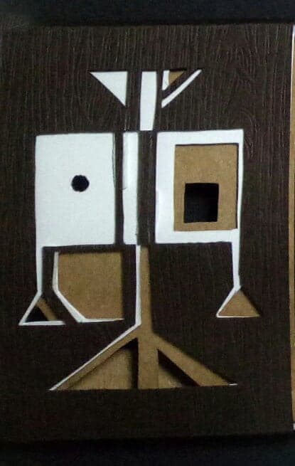 Libra chocolate box: geometric paper-cut sign emblem on dark wood-textured paper